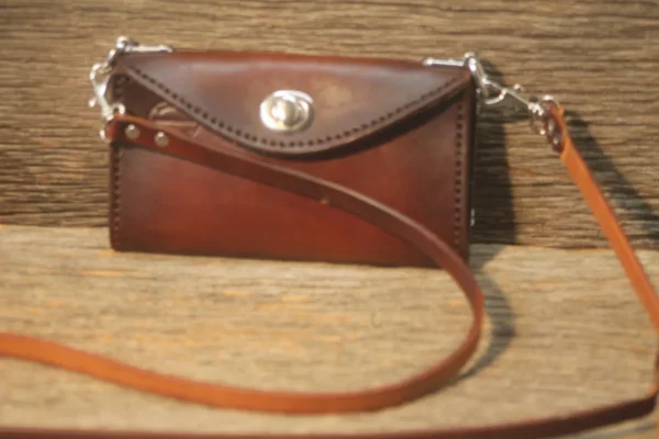 Ladies clutch purse with crossover strap